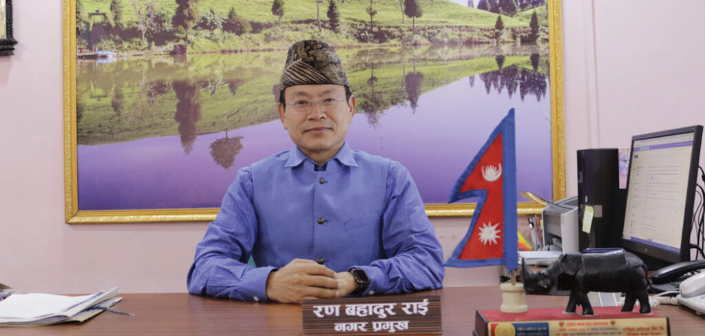 picture of ran bahadur rai mayor suryodaya municipality in his work desk.