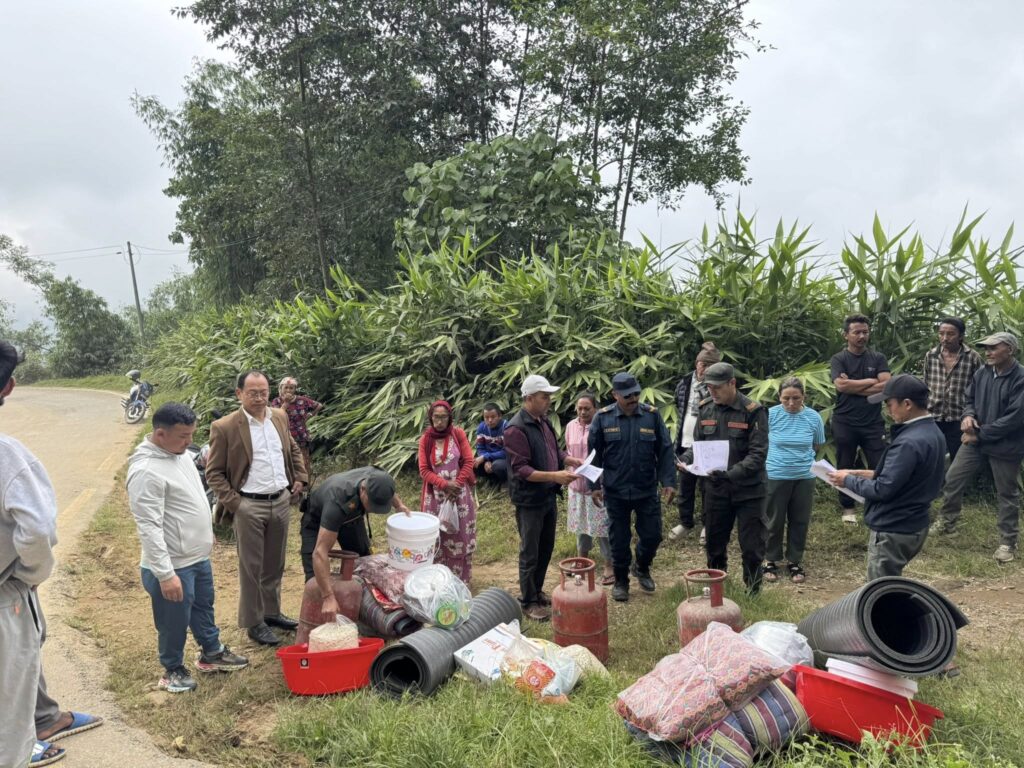 distribution of aid by suryodaya municipality in ward 9 in the presence of mayor of suryodaya muncipality to displaced families after heavy rainfall