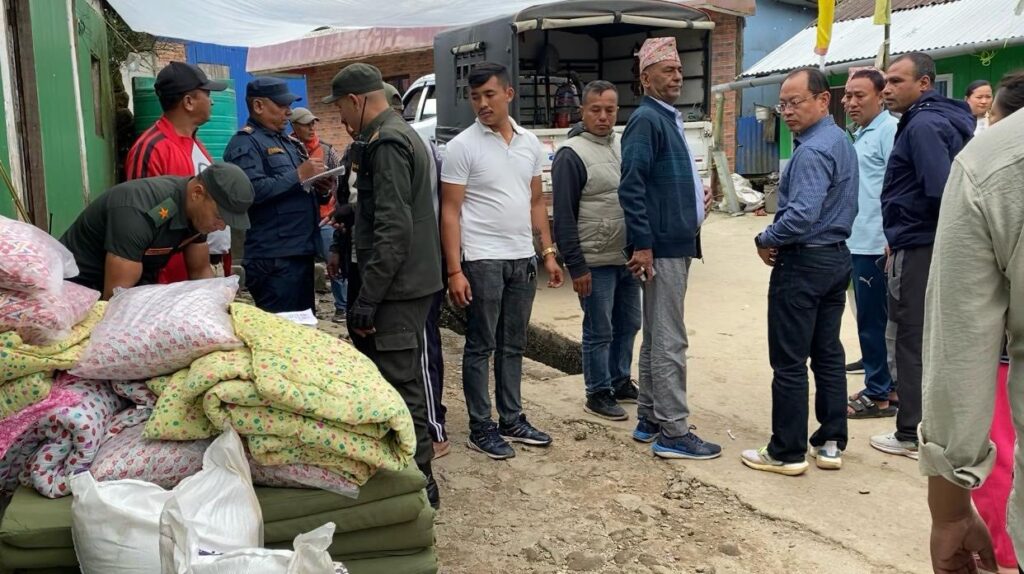 mayor of suryodaya municipality with deputy mayor along with other concerned officials in the relief distribution following the calamities caused by inesseant rainfall in ashoj 18 and 19