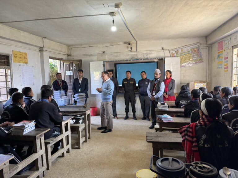 mayor of surydaya municiplaity engaging with the students in the classroom during mathematics practice books distribution programme 2082
